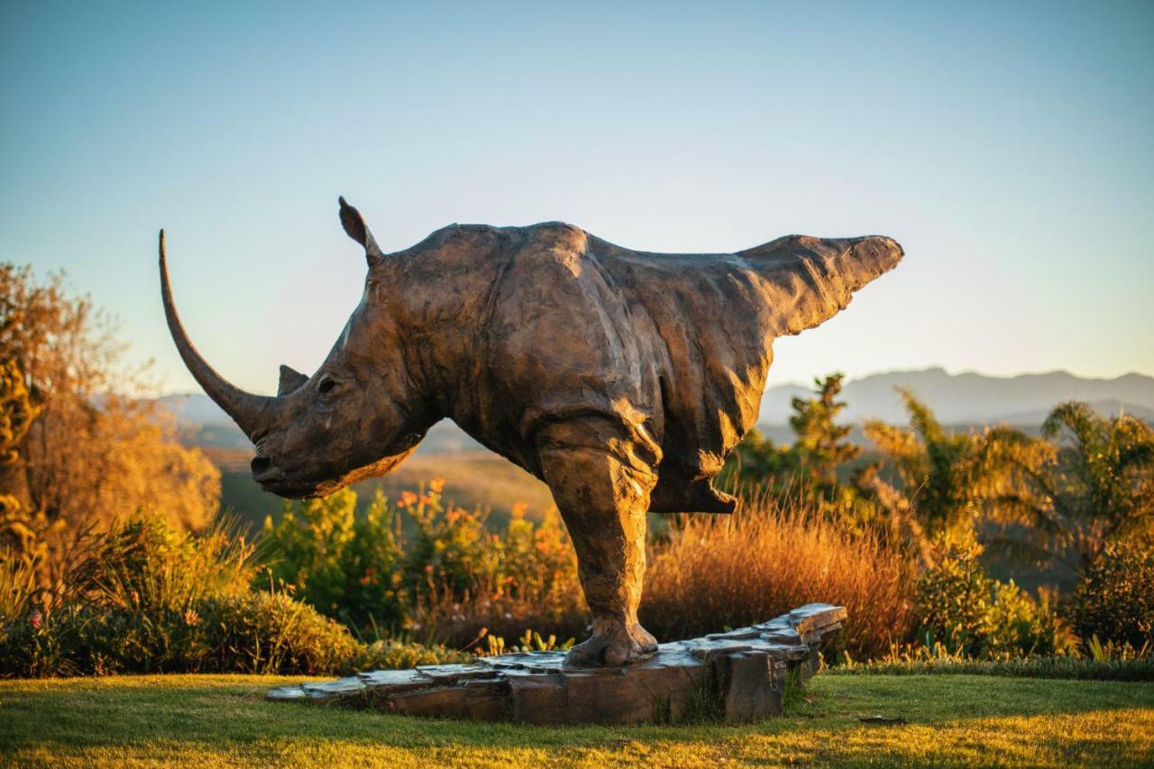 Sky Villa Boutique Hotel By Raw Africa Collection Plettenberg Bay Exteriör bild The sculpture of a white rhinoceros at the entrance of the park
